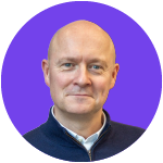 Person smiling against a purple background.