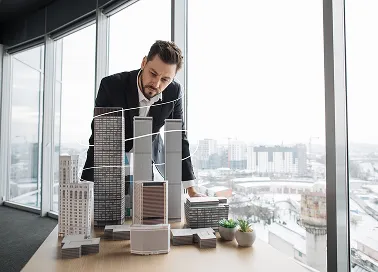 A man in an office attire illustrating construction service architecture.