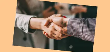 A handshake between two people.