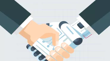 Human and robot hands shaking in agreement.