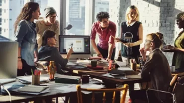 A group of people collaborating in a modern office.