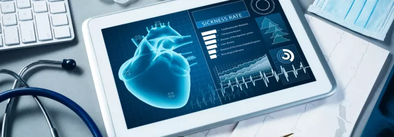 Tablet displaying a digital heart and medical data analysis.