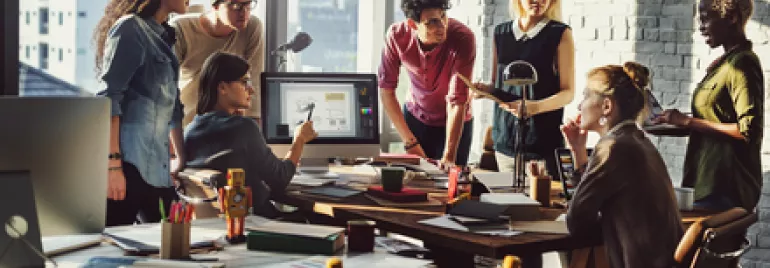 A group of people collaborating in a modern office.