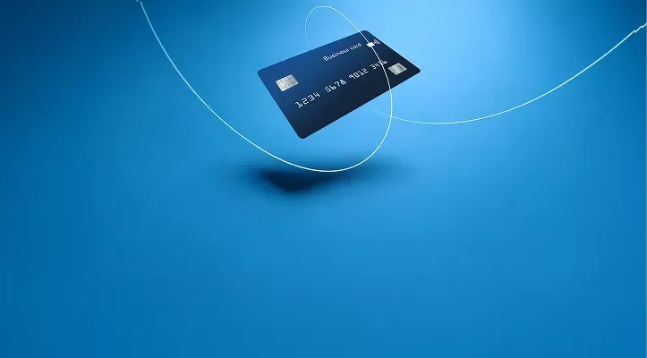 A credit/debit card with a blue background.
